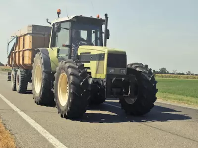 Tractor driving on a road with a load