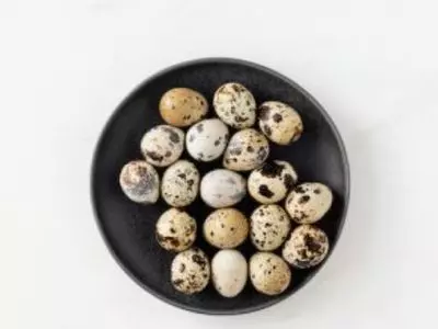 Multiple quail eggs on a plate