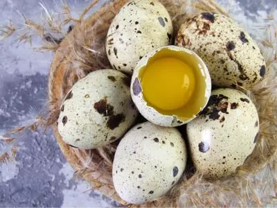 quail eggs together with one opened