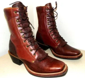 A pair of lace-up vintage cowboy boots